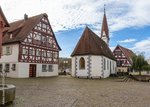 old half-timbered house and old church on the market square of Plochingen in Germany photo