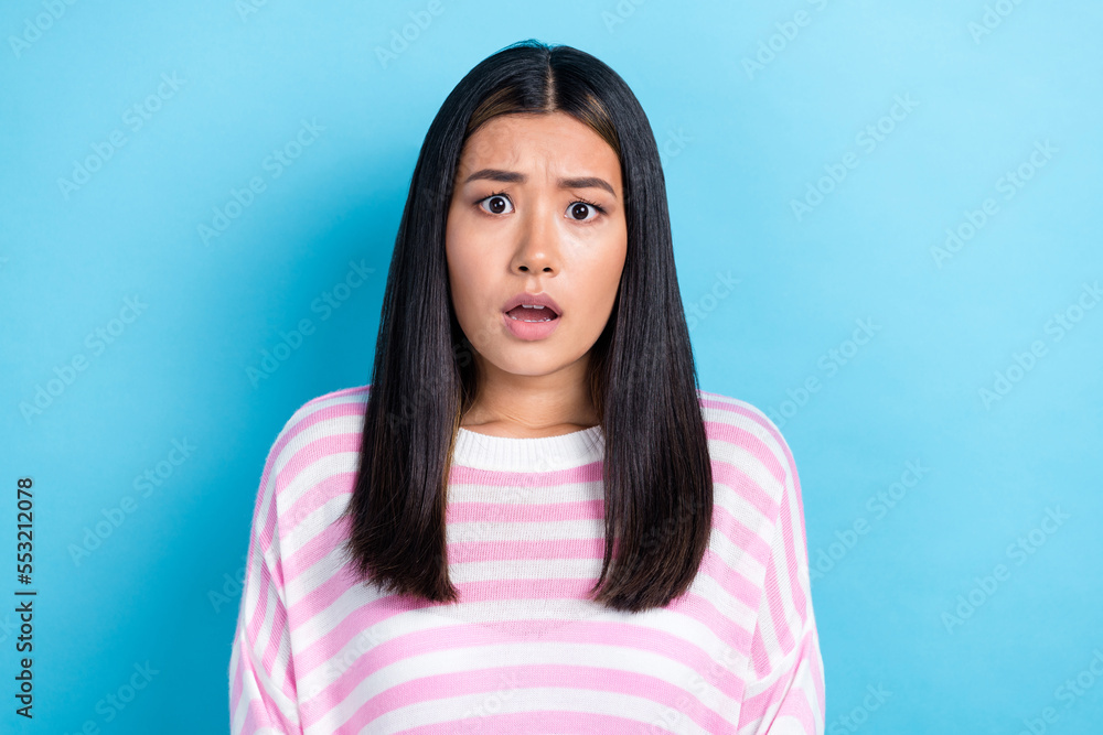 Photo of shocked impressed girl dressed pink pullover open mouth isolated blue color background Photo of shocked impressed girl dressed pink pullover open mouth isolated blue color background