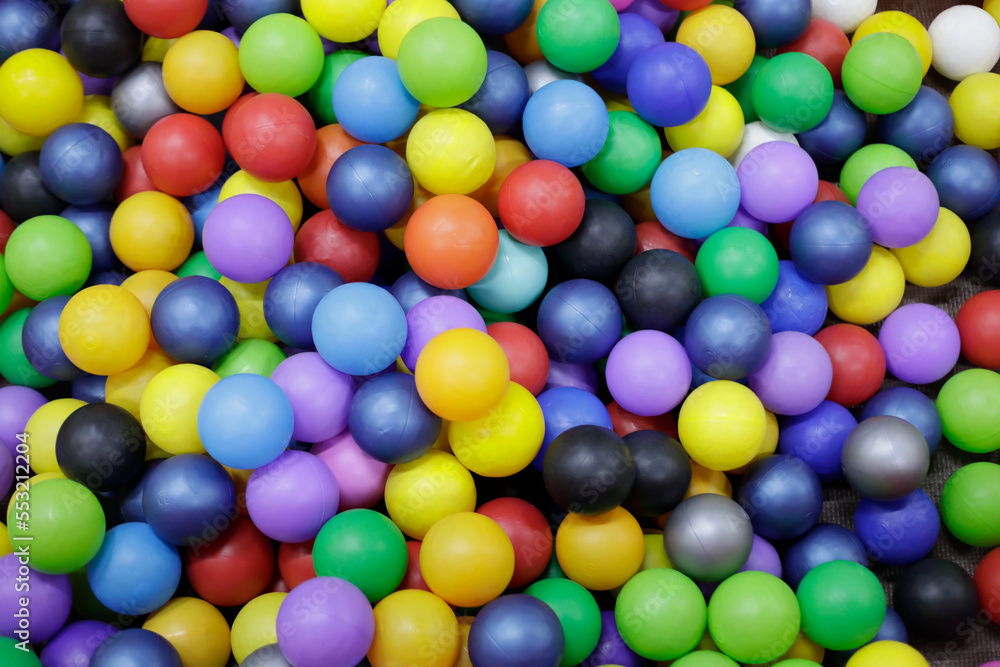 Multicolored plastic balls on children's playground Multicolored plastic balls on children's playground