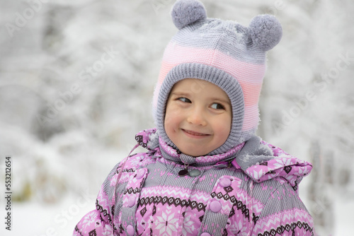 Happy Toddler girl winter portrait. Playing outside on Christmas holiday