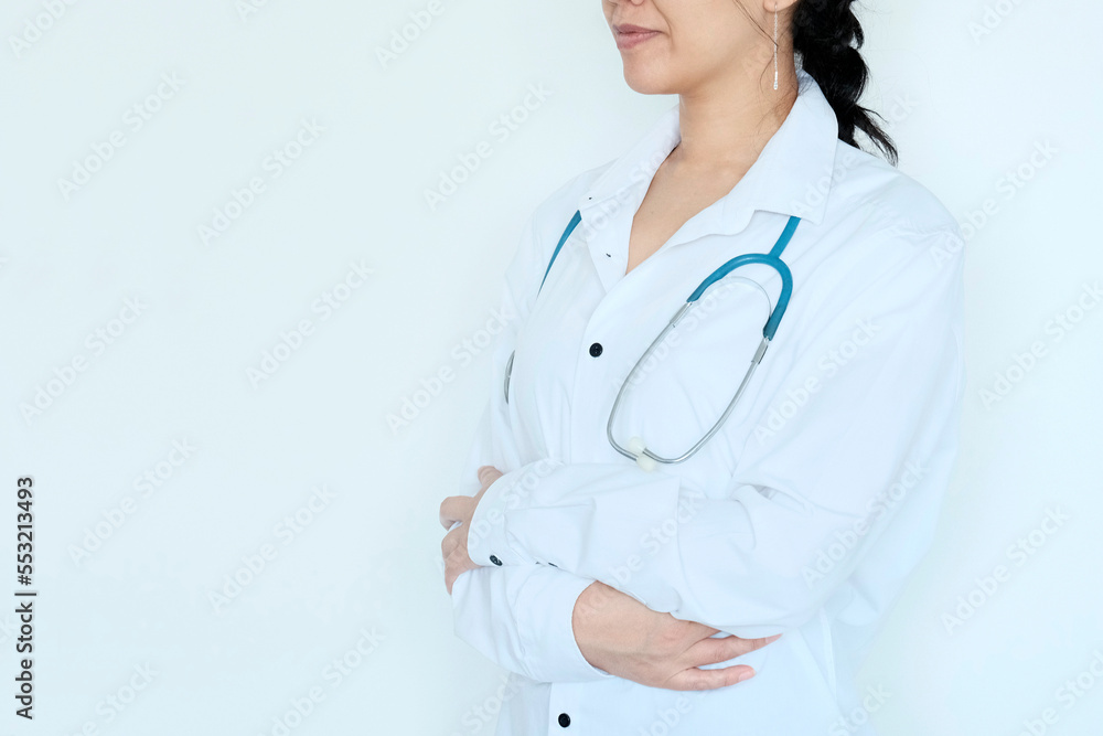 Doctor, Asian woman in white medical clothes and glasses. The concept of a doctor's appointment. Polyclinic, health services. Internship, medic's day. Doctor, Asian woman in white medical clothes and glasses. The concept of a doctor's appointment. Polyclinic, health services. Internship, medic's day.