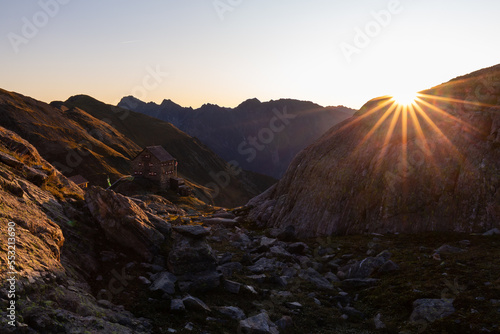 Super colorful morning in the Alpine hut with sun rays