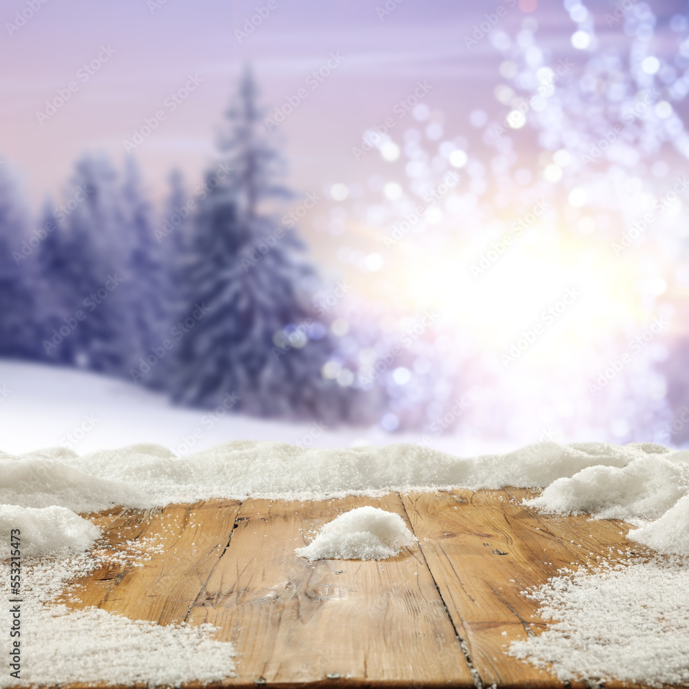 Desk of free space cover of snowflakes and forst with landscape of mountains. 