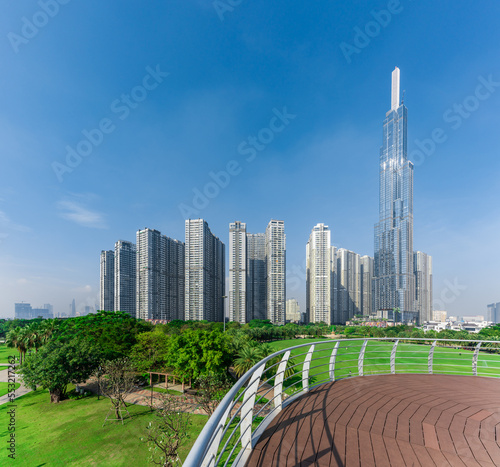 Landmark 81, skyscrapers viewed from below towards sky represents urban development with modern architecture. Combined with Vinhomes Central Park Project photo