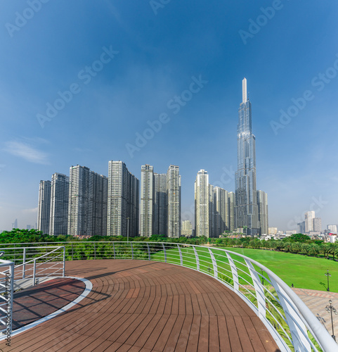 Landmark 81, skyscrapers viewed from below towards sky represents urban development with modern architecture. Combined with Vinhomes Central Park Project