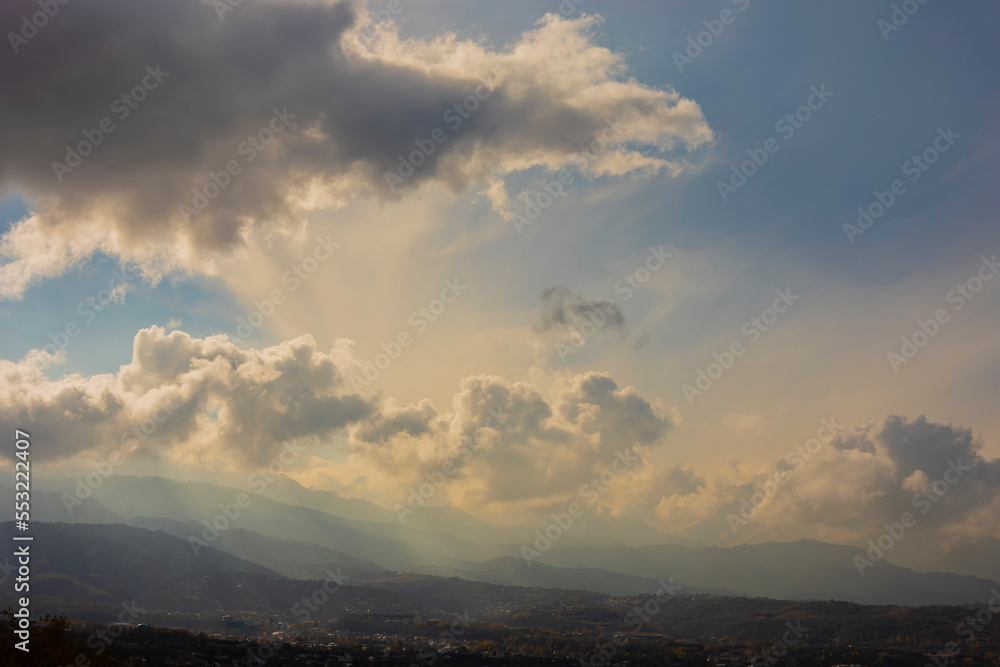 Beautiful morning sky and clouds view with silhouettes of mountains on background. Beautiful natural landscape. Kok tobe hills in Almaty Kazakhstan Beautiful morning sky and clouds view with silhouettes of mountains on background. Beautiful natural landscape. Kok tobe hills in Almaty Kazakhstan