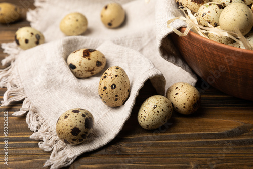 Quail eggs on a brown texture background. Environmentally friendly product. Source of calcium and protein. Healthy diet. Place for text. Place to copy.