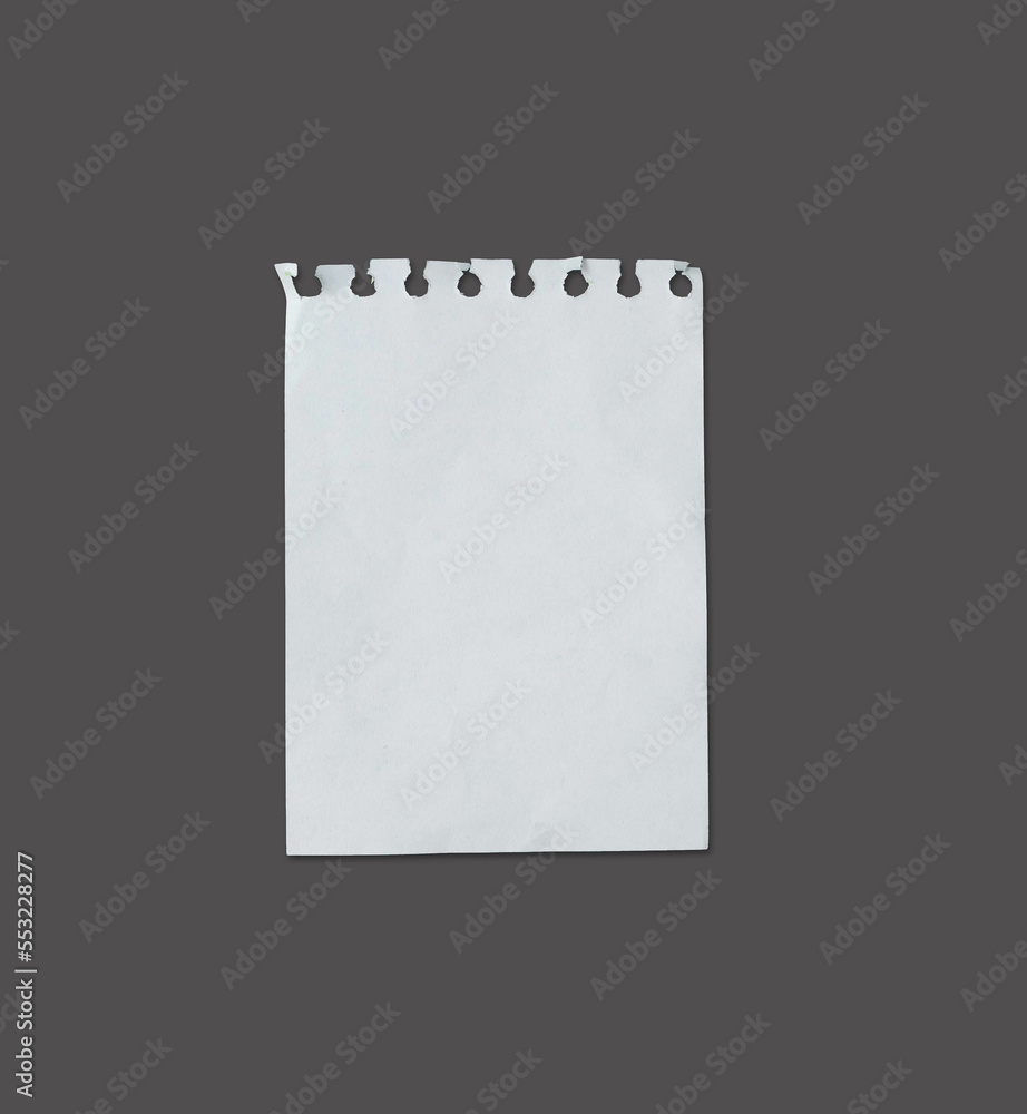 White ripped note, notebook paper stuck with sticky tape on black background. White ripped note, notebook paper stuck with sticky tape on black background.