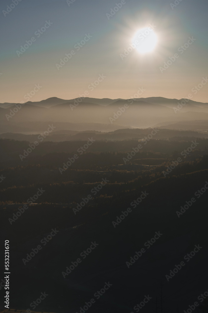 Sunrise in the Carpathian mountains. Autumn foggy landscape