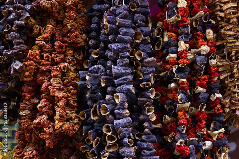 Sun dried eggplants and peppers strings hanging on spice bazaar store outdoors in Istanbul, Turkey Sun dried eggplants and peppers strings hanging on spice bazaar store outdoors in Istanbul, Turkey