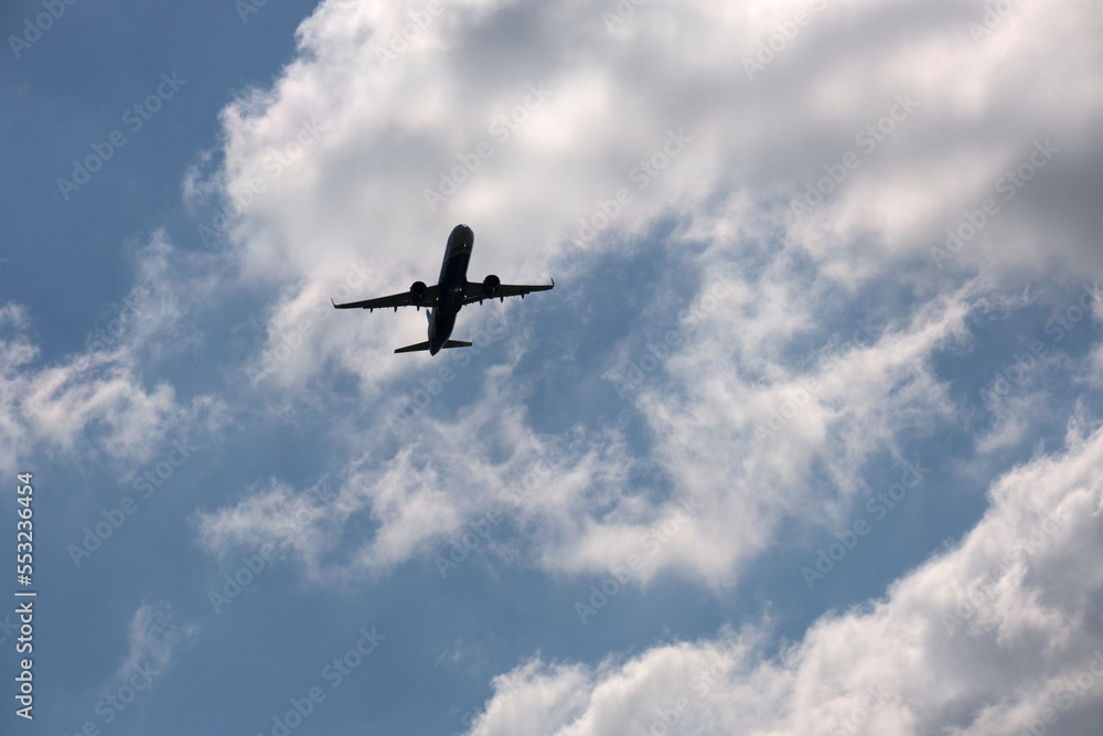 Airplane flying over blue sky and clouds Airplane flying over blue sky and clouds