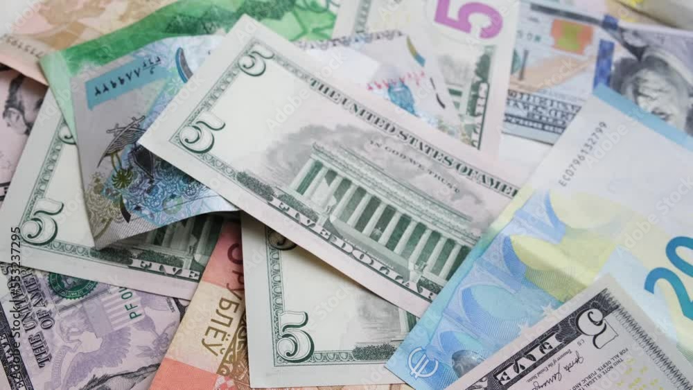 Background from different banknotes of dollars, belarusian rubles and euros. Concept of economic crisis and save money Background from different banknotes of dollars, belarusian rubles and euros. Concept of economic crisis and save money