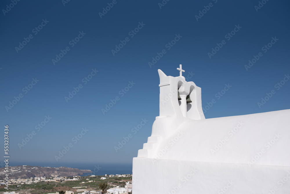 White church bells in Pyrgos, Santorini island, Greece