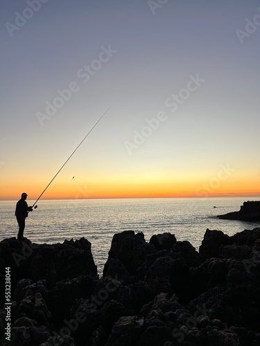 Angler im Sonnenuntergang