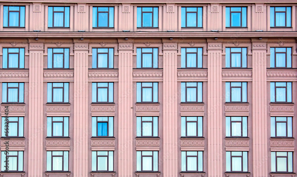 building facade with windows. residential building industry in the city