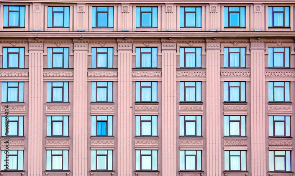 building facade with windows. residential building industry in the city building facade with windows. residential building industry in the city