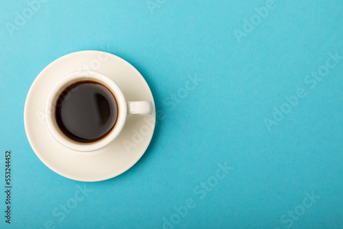 Cup of coffee on a blue background. Espresso. View from above. Space for copy. MOCAP. Breakfast. good morning.