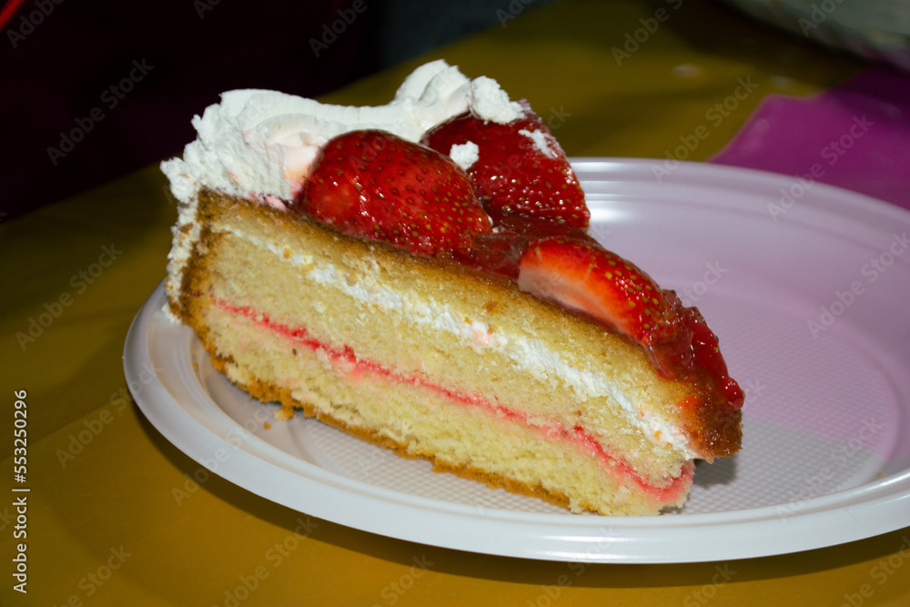 piece of strawberry cake with dulce de leche cream served on a white plate piece of strawberry cake with dulce de leche cream served on a white plate