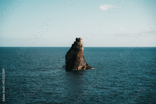 Solitude of a lone stone at the edge of the sea on Madeira