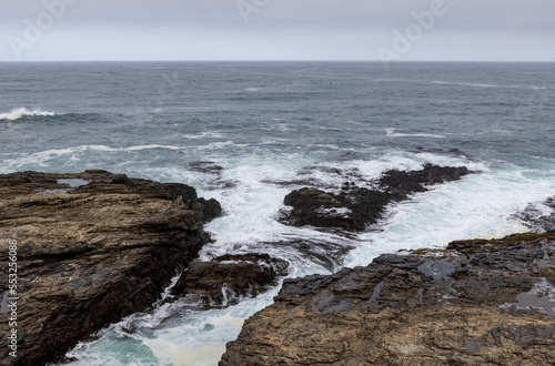 Hiking along the rough coast at Pichilemu, Chile