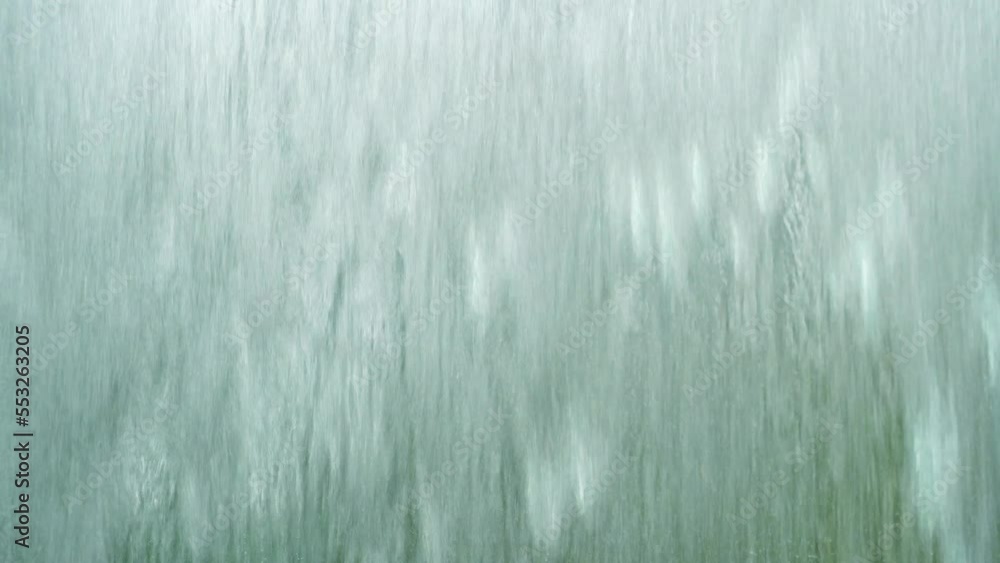 Water flowing through frosted glass. Water surface background. Water flowing through frosted glass. Water surface background.