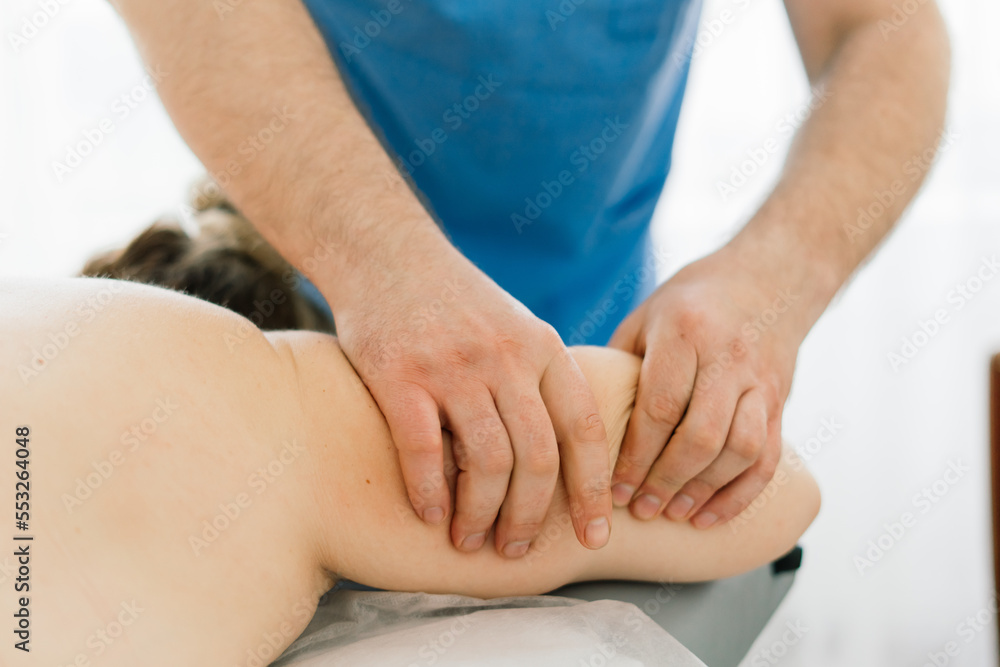 Young fat woman getting massage treatment in day spa cabinet. Young fat woman getting massage treatment in day spa cabinet.