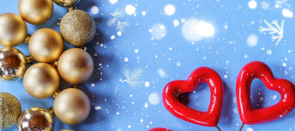 Fototapeta premium Festive Christmas and new year decorations on blue paper background,flat lay,top view.