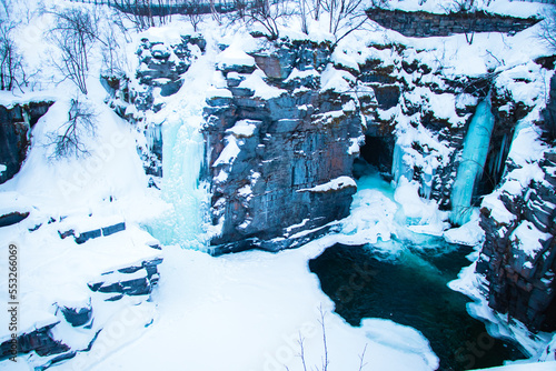 Frozen Waterfall Landscape in Abisko National Park, Sweden in Winter © Jasper Neupane
