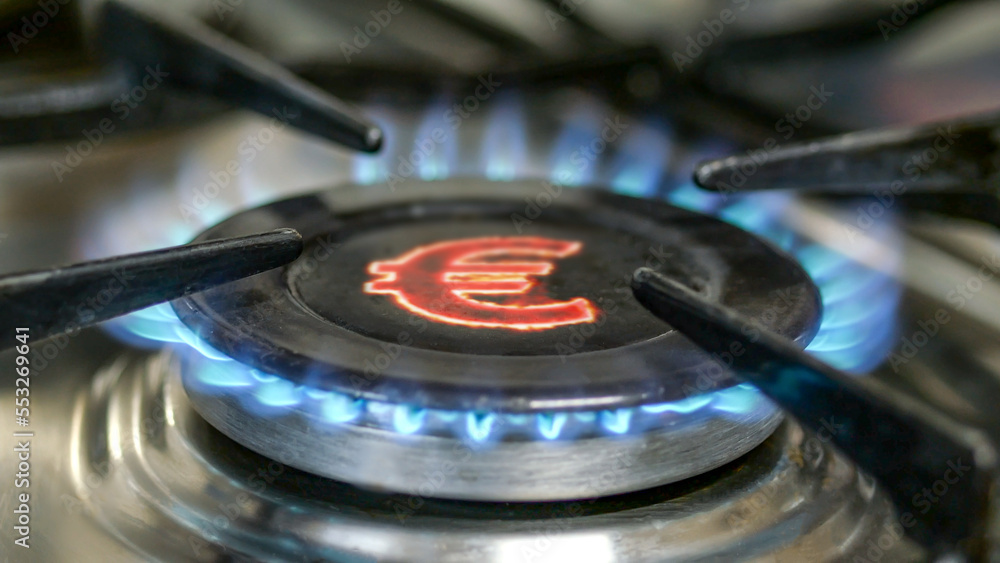 Gas ring burner and Euro sign, European money symbol on home gas stove. Concept of energy crisis. Selective focus. Gas ring burner and Euro sign, European money symbol on home gas stove. Concept of energy crisis. Selective focus.