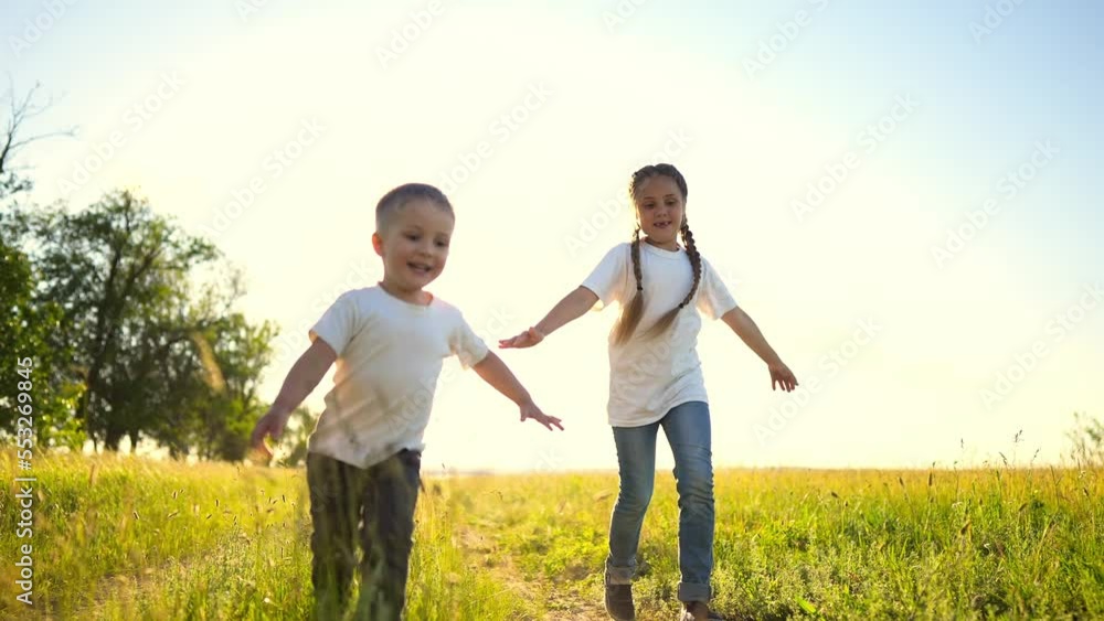 happy family kids. people in the park children child running together in the park at sunset silhouette. mom dad daughter and son are run happy family and little fun child in summer. dream kids run happy family kids. people in the park children child running together in the park at sunset silhouette. mom dad daughter and son are run happy family and little fun child in summer. dream kids run
