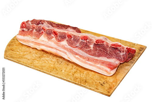 Raw pork ribs on wooden cutting board. Isolated.