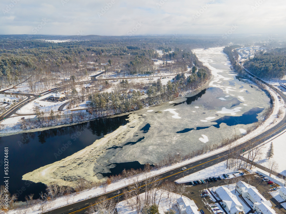 Merrimack River aerial view in winter in town center of Tyngsborough, Massachusetts MA, USA.