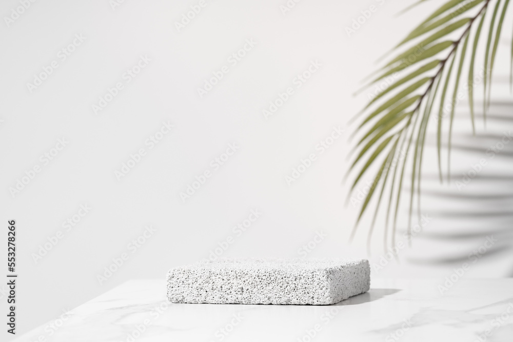 Porous pedestal on white table for beauty cosmetic product presentation. Bathroom shelf mockup. - obrazy, fototapety, plakaty 