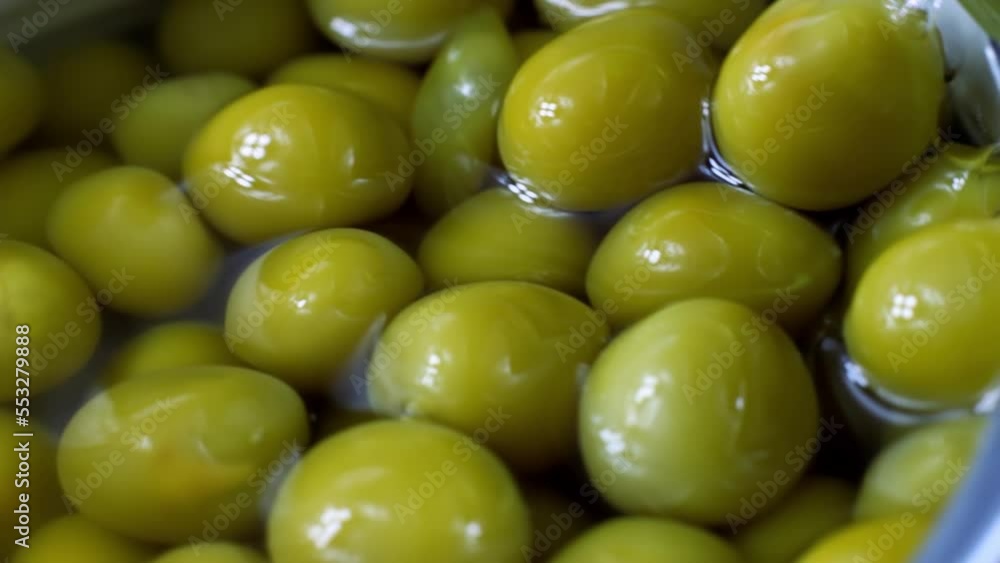 Marinated sweet green peas in metal can container close up Marinated sweet green peas in metal can container close up