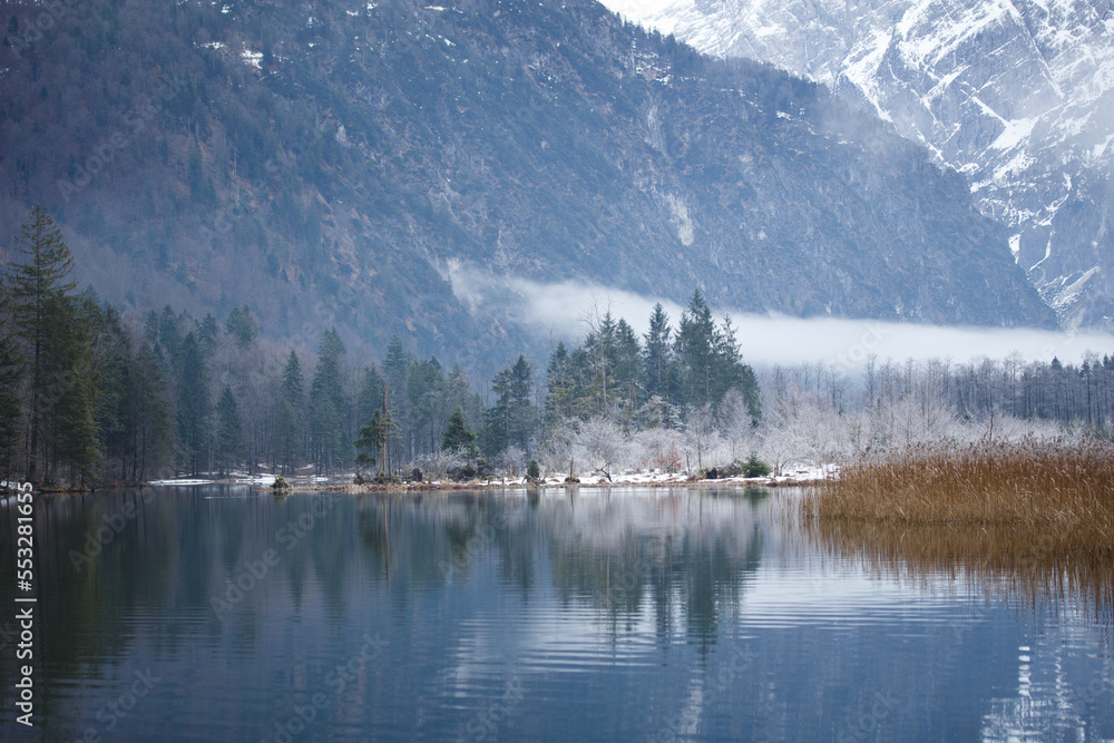 Mountain Lake and Snowy Mountains on a Misty Winter Day in Austria