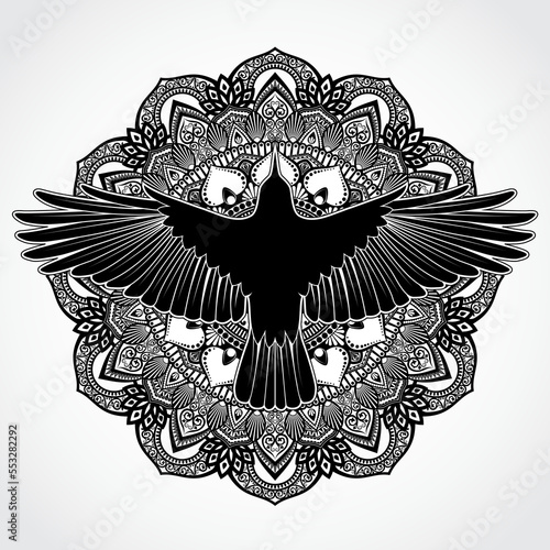 elegant mandala with silhouette crow