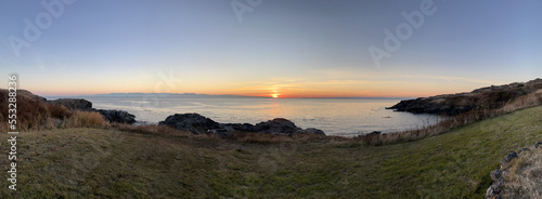 Panoramic view of the coast of San Juan Island at sunset photo