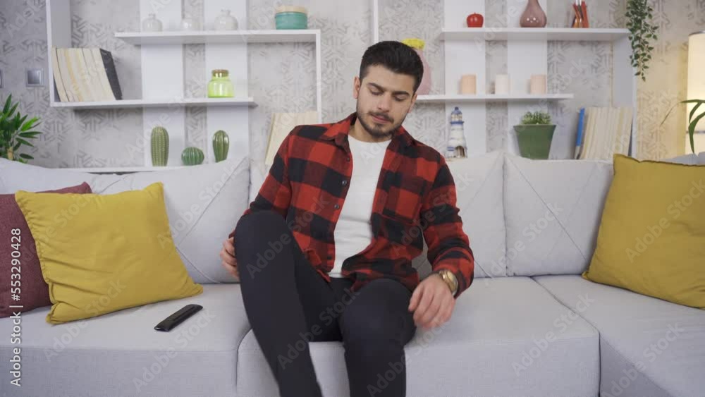 Young men's feet stink and he is disgusted. The man who comes home