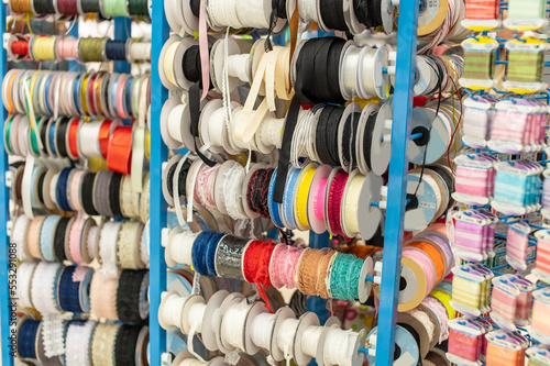 Assortment of multicolored ribbons in the needlework store