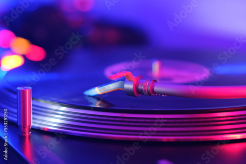 DJ Turntable with vinyl with music background