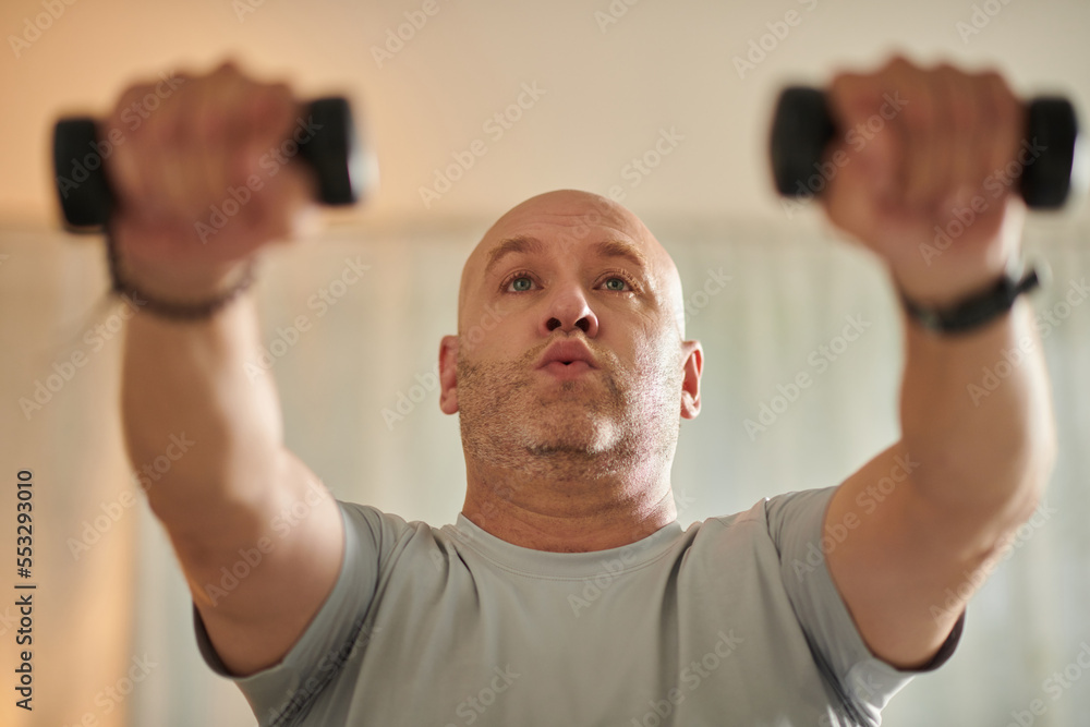 Man Working out with Dumbbells Man Working out with Dumbbells