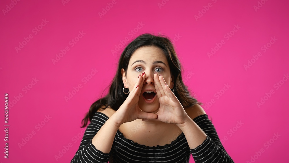Portrait of pretty happy young woman 20s smiling scream and shout calling inviting with hands at mouth say hey you isolated on pink background. Portrait of pretty happy young woman 20s smiling scream and shout calling inviting with hands at mouth say hey you isolated on pink background.