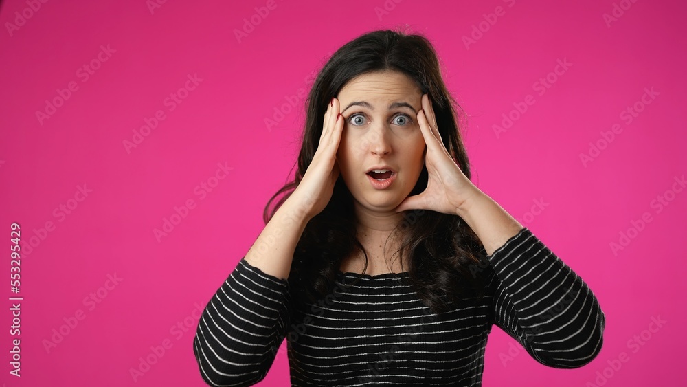 Portrait of pretty brunette young woman 20s 30s years old posing isolated on pink background studio. Cover mouth with hands on face say wow omg no way Portrait of pretty brunette young woman 20s 30s years old posing isolated on pink background studio. Cover mouth with hands on face say wow omg no way