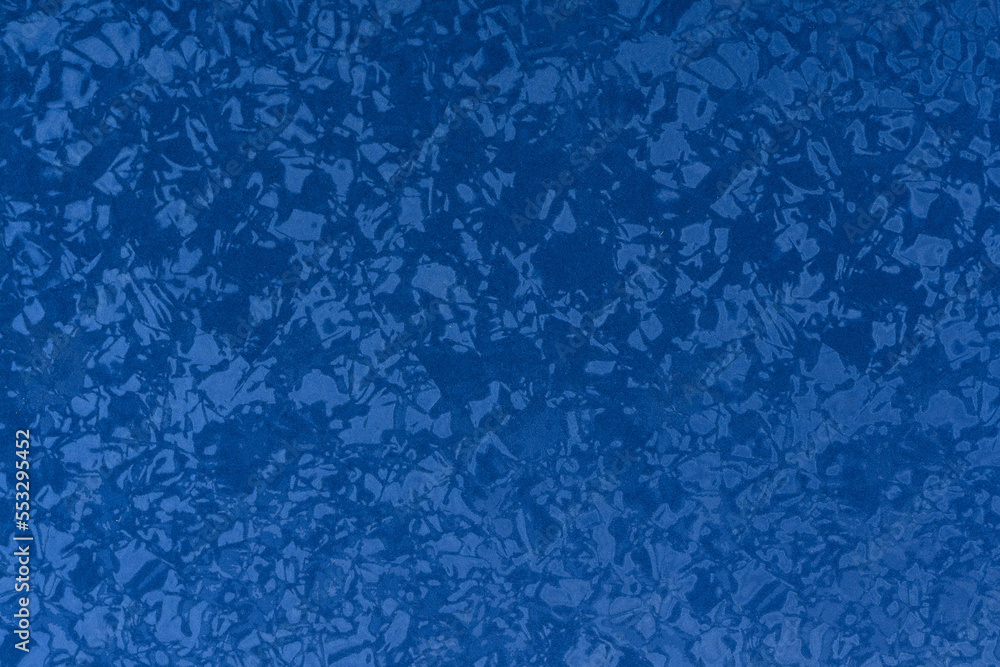The texture of a blue fabric with shimmers and shine. horizontal framing The texture of a blue fabric with shimmers and shine. horizontal framing