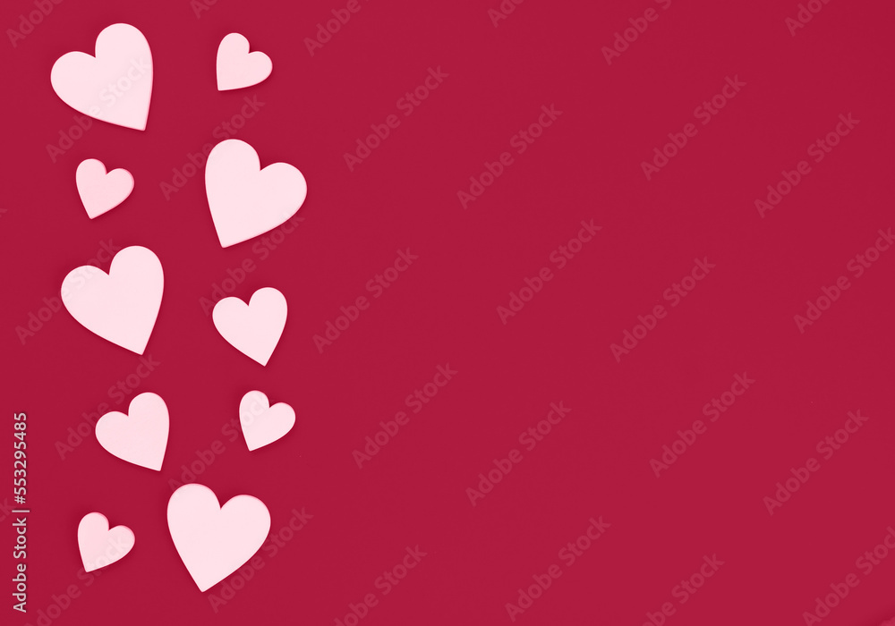 Many white hearts on the right side on a magenta background with place for text. Copy space
