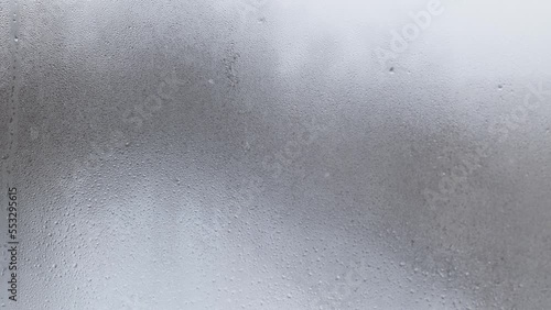 drops of condensation on the glass. misted glass during snowfall