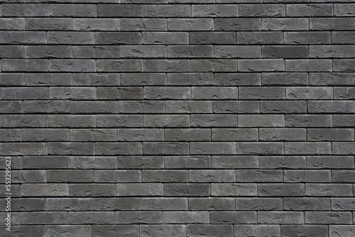 Photo Grey brick wall texture background. Tiled.