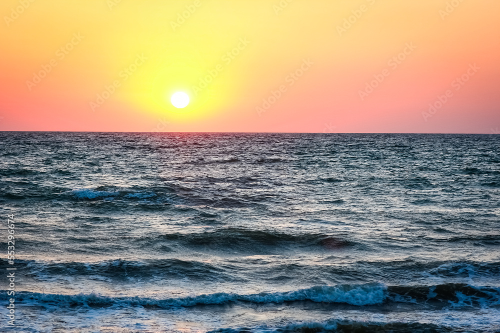 Fototapeta premium A Beautiful sunset with sea reflection background travel