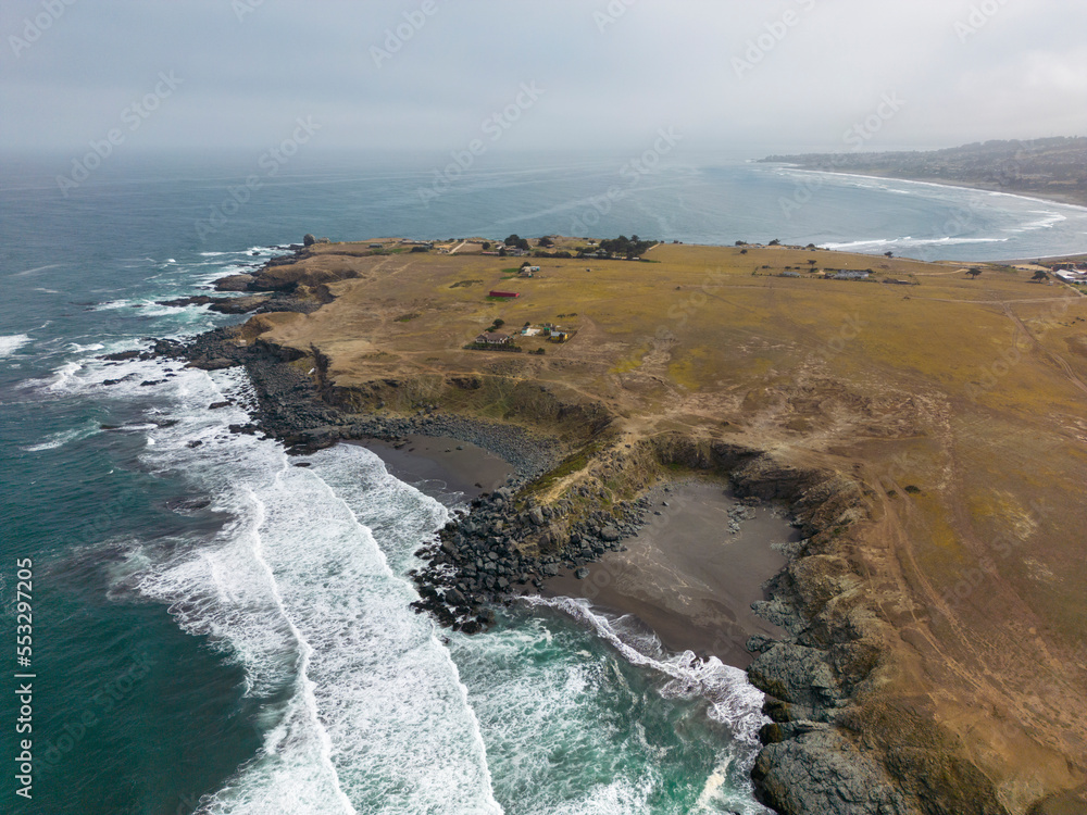 Aerial shot of the pacific ocean, beach and the bay La Pancora at Pichilemu, Chile Aerial shot of the pacific ocean, beach and the bay La Pancora at Pichilemu, Chile