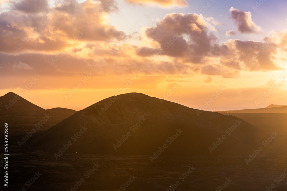 Amazing sunset over El Cuervo Volcano, in Lanzarote, Canary Islands,  Spain